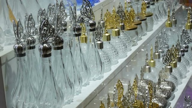 A variety of empty glass perfume bottles on a store counter in Istanbul