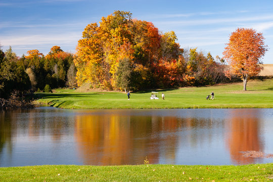 Landscape Fall Foliage And Lake At Golf Course