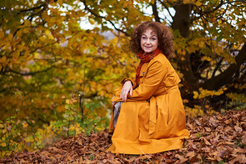Fototapeta na wymiar Autumnal portrait of a mature woman