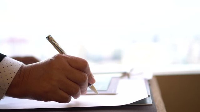 Businessman executive signing contract making deal on official document paperwork files for approval legal finance on management of responsible, signature meeting for startup people concept. 4k