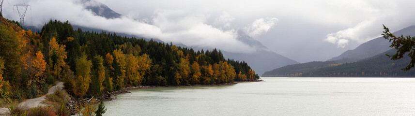 Beautiful Panoramic Landscape View of a Scenic road in Canadian Nature during a Cloudy Autumn Day. Taken at Lillooet Lake, Pemberton, British Columbia, Canada.