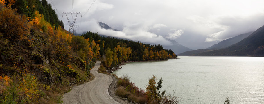 Beautiful Panoramic Landscape View of a Scenic road in Canadian Nature during a Cloudy Autumn Day. Taken at Lillooet Lake, Pemberton, British Columbia, Canada.