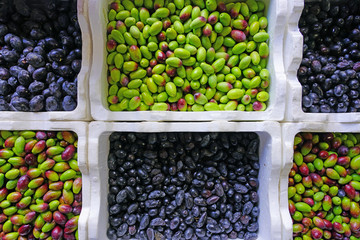 Fresh green and black olives at a market in Australia