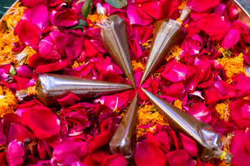 Indian wedding. Mehndi cone.Indian Pakistani Mehndi Cone on flowers for wedding 