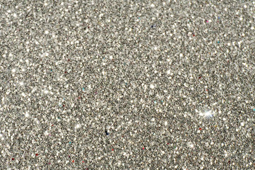 Silver Sparkling Lights Festive background with texture. Abstract Christmas twinkled bright bokeh defocused and Falling stars. Winter Card or invitation	