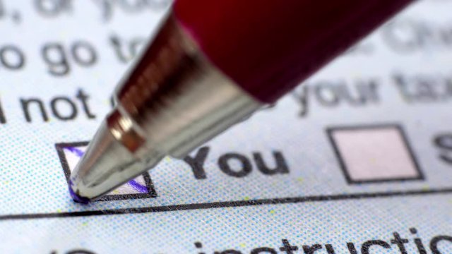 Fill in a form questionnaire. Extreme close up.