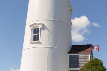 Fototapeta premium Nobska Point Light Lighthouse, Woods Hole, Falmouth, Cape Cod, Massachusetts in the fall, detail view of window in white light house, New England scenic holiday destination