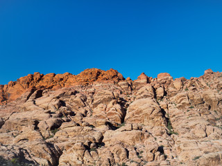 Fototapeta na wymiar Red Rock Canyon National Conservation Area, Nevada in the Mojave Desert. The beautiful red rock formations are made of Aztec sandstone from lithified sand dunes.