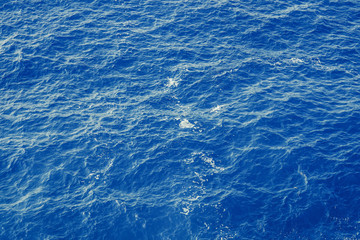 Blue sea surface with waves aerial view