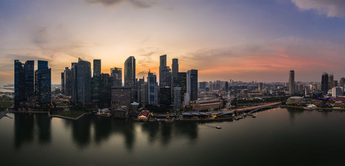 Stunning sunset over the famous Singapore skyline by the Marina in Southeast Asia main financial center