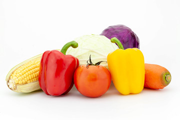 Fresh vegetables: cabbage, bell peppers, carrot, tomato,corn isolated on white background