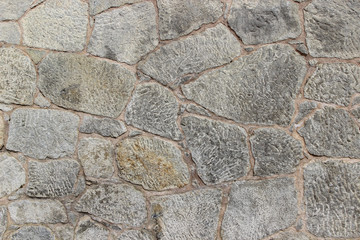 Wall made of natural rocks of different sizes and shapes