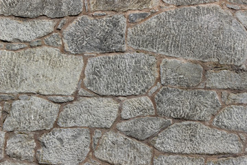 Wall made of natural rocks of different sizes and shapes