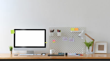 Workspace of creative designer with empty display computer.