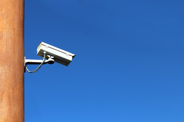 cctv security camera with record controller box on blue sky background, eye of sky