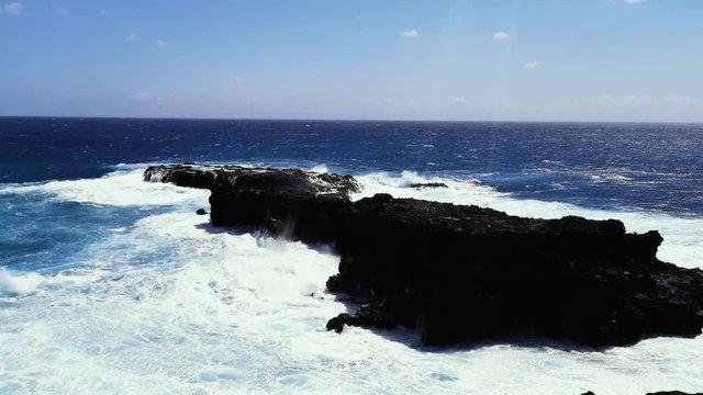 Sea Cliff and Rocky Shoreline with Eroded Lava Volcanic Rock in Rapa Nui
