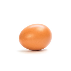 One orange chicken egg. Close up. Isolated on white background