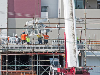 Assembling and erecting a construction Tower Crane with the aid of a Mobile Boom Crane. Australia. ...