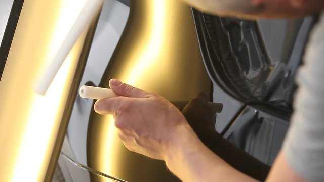 rectification of dents on the metal surface of the car. Metal heating, reflection on the car