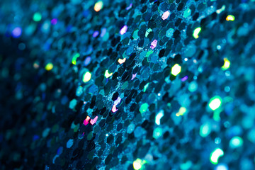 Abstract background of bright deep blue glitter texture with bokeh