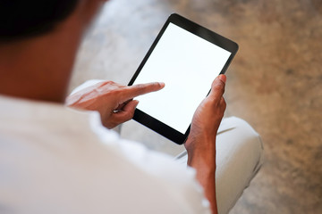 Cropped shot view of man hands holding smart phone with blank copy space screen for your text message or information content, female reading text message on cell telephone during in urban setting. 