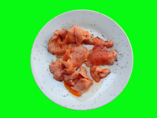 Salmon food scraps on a white plate that many ants eat