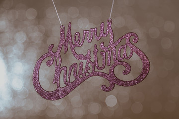 Merry Christmas lettering on shiny silver background