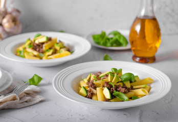 Delicous pasta with beef and fresh avocado