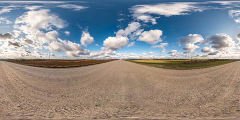 Fototapeta na wymiar blue sky with rain storm fluffy clouds. full seamless eamless hdri panorama 360 degrees angle view on gravel road with zenith in equirectangular projection, ready for VR AR virtual reality