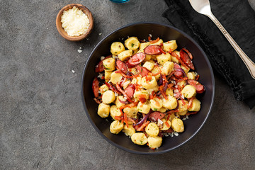 Homemade gnocchi with smoked sausage and bacon.