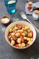 Homemade gnocchi with smoked sausage and bacon.