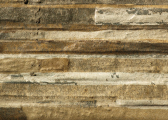 Red background facade plaster. Monolithic plaster decorative backdrop. Single layer scraped cement plaster wallpaper. Concrete exterior building structure backdrop. Silica sand cement wall plaster