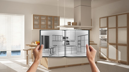 Hands holding notepad with creative kitchen design blueprint sketch or drawing. Real interior design project background. Before and after concept, architect designer work flow idea