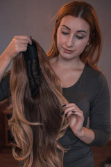 Fototapeta premium Wigs, hair. Womens beauty concept