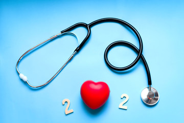 Happy New Year 2020 of doctor Stethoscope with red heart on blue background, Pharmacy and Happy New Year for medical and health concept