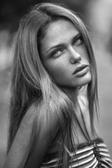 Sensual close up outdoor portrait of a caucasian girl with freckles.