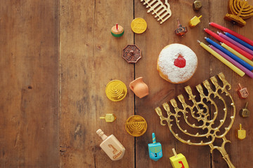 religion image of jewish holiday Hanukkah background with menorah (traditional candelabra), spinning top and doughnut