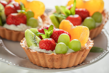 Closeup of mini tart made of summer fruits and cream