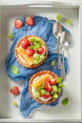 Tasty mini tart with mix of fruits and cream © shaiith