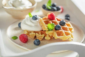 Homemade waffles with fresh blueberries and raspberries