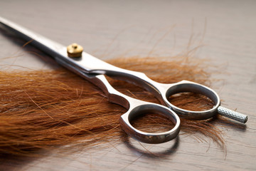scissors with a lock of hair