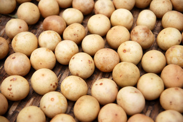 Fruit scene of yellow rambai fruit on the wood plank - closeup