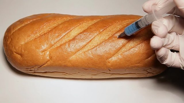 bread syringe hand glove white background hd footage 