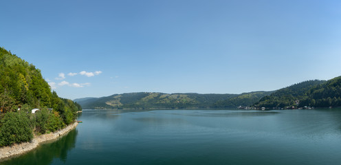 Fototapeta na wymiar Beautiful panoramic view of Lake Izvorul Muntelui (Lacul Bicaz) from the dam, Romania