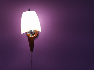 Warm light lamp Modern style Wall mounted Purple background has Space for design text.