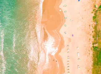 Aerial top down beach view with DRONE in Montanita. Dramatic view of the turquoise ocean, orange...