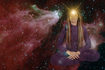 girl with soulful look against background of starry sky. on forehead of girl glowing star symbol of...