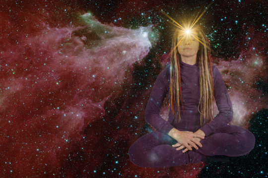 girl with soulful look against background of starry sky. on forehead of girl glowing star symbol of open mind. paranormal abilities, clairvoyance, mysticism. Elements of this image furnished by NASA