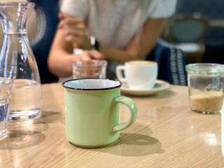 cup of coffee on wooden table in a cafe