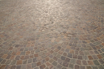 Old cobblestone pavement close-up.
